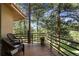 Secluded balcony offering seating and views of the surrounding mountain landscape at 2235 Stonecrop Way, Golden, CO 80401