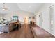 A spacious living room features hardwood floors, vaulted ceilings, and multiple doorways leading to other areas at 2235 Stonecrop Way, Golden, CO 80401