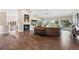 Spacious living room boasts hardwood floors, fireplace, and abundant natural light with mountain views at 2235 Stonecrop Way, Golden, CO 80401
