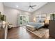 Bright main bedroom with a balcony, vaulted ceilings, and an inviting atmosphere at 2235 Stonecrop Way, Golden, CO 80401