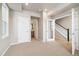 A bright, carpeted bedroom with recessed lighting and en suite bathroom at 1727 W 166Th Ave, Broomfield, CO 80023