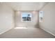 Spacious bedroom featuring neutral carpet, recessed lighting, and bright windows with natural light at 1727 W 166Th Ave, Broomfield, CO 80023