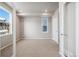 An empty bedroom with neutral carpet, recessed lights, and a bright window at 1727 W 166Th Ave, Broomfield, CO 80023