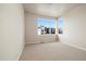 Bright bedroom featuring neutral walls, plush carpeting, and a large window offering plenty of natural light at 1727 W 166Th Ave, Broomfield, CO 80023