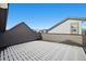 Open deck area covered in snow, featuring a dark railing, and neighborhood views at 1727 W 166Th Ave, Broomfield, CO 80023