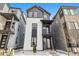 Charming exterior of a two-story home with black and white paint, and a small front yard at 1727 W 166Th Ave, Broomfield, CO 80023