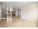 Open-concept living room leading to the kitchen, featuring hardwood floors at 1727 W 166Th Ave, Broomfield, CO 80023