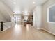 Spacious living room area with view of the kitchen and stairs at 1727 W 166Th Ave, Broomfield, CO 80023