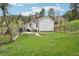Large grassy backyard with a patio, grill, and scenic mountain views at 11827 Brook Rd, Golden, CO 80403