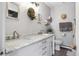 Bright bathroom with marble countertops, double sinks, and modern fixtures at 11827 Brook Rd, Golden, CO 80403
