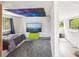 Bedroom features gray carpet, and a large screen television at 11827 Brook Rd, Golden, CO 80403