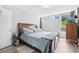 Comfortable bedroom with natural light, hardwood floors, and ample closet space at 11827 Brook Rd, Golden, CO 80403