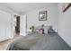 Bedroom featuring neutral walls, closet, and comfortable bed at 11827 Brook Rd, Golden, CO 80403