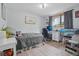 Bedroom with a desk, workspace, and natural lighting from the window at 11827 Brook Rd, Golden, CO 80403