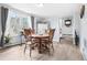 Inviting dining room featuring hardwood floors, bright natural light, and a classic wooden table at 11827 Brook Rd, Golden, CO 80403