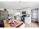 Well-equipped kitchen boasting stainless steel appliances, white cabinets, and lots of natural light at 11827 Brook Rd, Golden, CO 80403