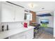 Open concept kitchenette flowing into living area at 11827 Brook Rd, Golden, CO 80403