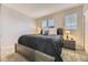 Comfortable bedroom with neutral walls, soft carpet, and bright natural light at 2951 W Riverwalk Cir # N, Littleton, CO 80123