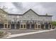 Attractive townhome exteriors, each featuring individual garages and private balconies for outdoor enjoyment at 2951 W Riverwalk Cir # N, Littleton, CO 80123