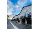 Modern townhouse exterior features private balconies above garages, enhanced by clean lines and updated facades at 2951 W Riverwalk Cir # N, Littleton, CO 80123