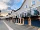 Charming townhomes featuring brick garages and balconies, creating an inviting street appeal at 2951 W Riverwalk Cir # N, Littleton, CO 80123