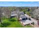 Aerial view of an estate featuring a spacious home, a large garage, and a meticulously maintained lawn at 4682 S Franklin St, Englewood, CO 80113