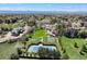 Expansive property showcasing a tennis court and meticulously landscaped gardens against a scenic backdrop at 4682 S Franklin St, Englewood, CO 80113