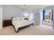 Serene bedroom with blue walls, window seat and natural light at 4682 S Franklin St, Englewood, CO 80113