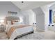 This bedroom boasts a cozy window seat, a plush rug, white walls, and soft, natural light at 4682 S Franklin St, Englewood, CO 80113