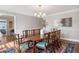 Elegant dining room with a large wooden table, decorative rug and ample natural light at 4682 S Franklin St, Englewood, CO 80113