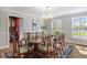 Traditional dining room featuring a wood table, decorative chairs, and abundant natural light at 4682 S Franklin St, Englewood, CO 80113