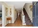 Inviting foyer with hardwood floors, a staircase, and elegant decor at 4682 S Franklin St, Englewood, CO 80113