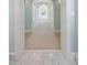 Hallway featuring marble floors, arched doorways and light blue walls at 4682 S Franklin St, Englewood, CO 80113