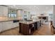 Spacious kitchen with a large island, stainless steel appliances, and hardwood floors at 4682 S Franklin St, Englewood, CO 80113