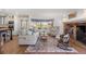 Charming living room with a brick fireplace, large windows, and comfortable seating at 4682 S Franklin St, Englewood, CO 80113