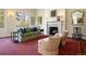 Bright living room with a fireplace, plush seating, and elegant decor at 4682 S Franklin St, Englewood, CO 80113
