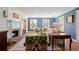 Cozy living room featuring a fireplace, hardwood floors, and abundant natural light at 4682 S Franklin St, Englewood, CO 80113