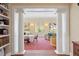 Elegant living room with columns leading to a sitting area, with large windows and natural light at 4682 S Franklin St, Englewood, CO 80113