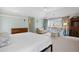 Spacious main bedroom featuring a sitting area, plush carpets, and abundant natural light at 4682 S Franklin St, Englewood, CO 80113