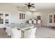 A covered patio features a full outdoor kitchen, ceiling fan, and ample seating for gatherings at 4682 S Franklin St, Englewood, CO 80113