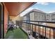 Private balcony offers a cozy outdoor retreat with artificial turf and comfortable seating for relaxation at 645 S Park Ave # 302, Breckenridge, CO 80424