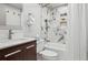 Elegant bathroom featuring marble-style tile in the shower, contrasting modern vanity, and sleek fixtures at 645 S Park Ave # 302, Breckenridge, CO 80424