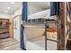 Unique bunk bed design with industrial-style metal supports and privacy curtains, offering a modern and functional space at 645 S Park Ave # 302, Breckenridge, CO 80424
