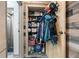 A fully stocked closet with shelves, cubbies, clothes, cleaning supplies and personal items at 645 S Park Ave # 302, Breckenridge, CO 80424