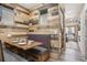 Cozy dining nook featuring wooden paneling, banquette seating, and stylish decor at 645 S Park Ave # 302, Breckenridge, CO 80424