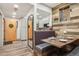Dining area with built-in booth seating, wood table, and stylish wood-paneled wall feature at 645 S Park Ave # 302, Breckenridge, CO 80424
