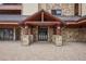 Building entrance featuring brick and wood architecture at 645 S Park Ave # 302, Breckenridge, CO 80424
