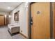 A hallway view showcasing a seating area outside an apartment door at 645 S Park Ave # 302, Breckenridge, CO 80424