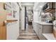Hallway with grey cabinets that lead to a cozy living space with a blue curtain divider at 645 S Park Ave # 302, Breckenridge, CO 80424