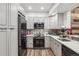 Modern kitchen featuring gray cabinetry, stainless steel appliances, and sleek countertops at 645 S Park Ave # 302, Breckenridge, CO 80424